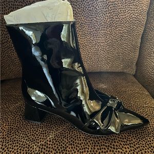 Larroude leather black patent bootie. Never worn.  Size 10.